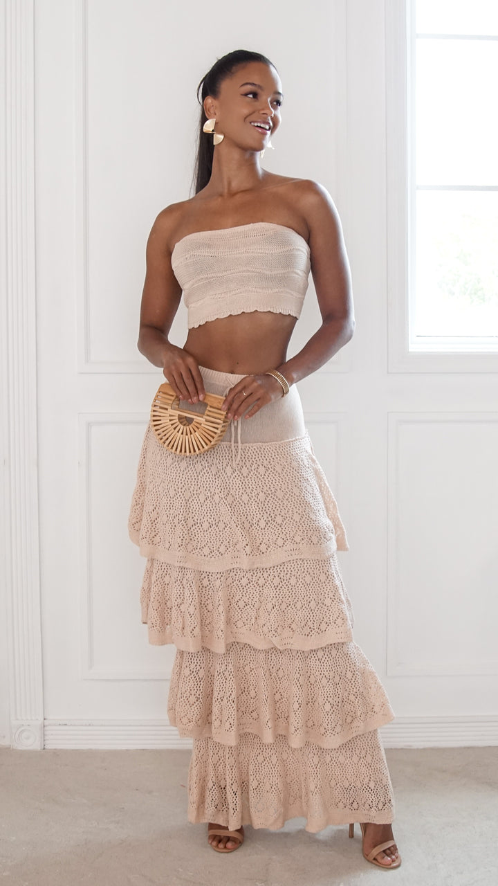front view image 5 of Elara Skirt SetStyle: strapless crop top with lace-up back and tiered maxi skirt
Neckline: strapless
Fit: fitted top with flowy skirt
Color: beige
Occasion: vacation, beach outings, brunch, summer events